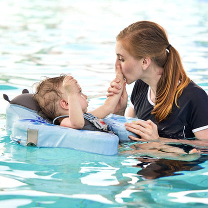 Infant safely swimming in a pool using the Mambobaby™ Butterfly Float for water confidence.