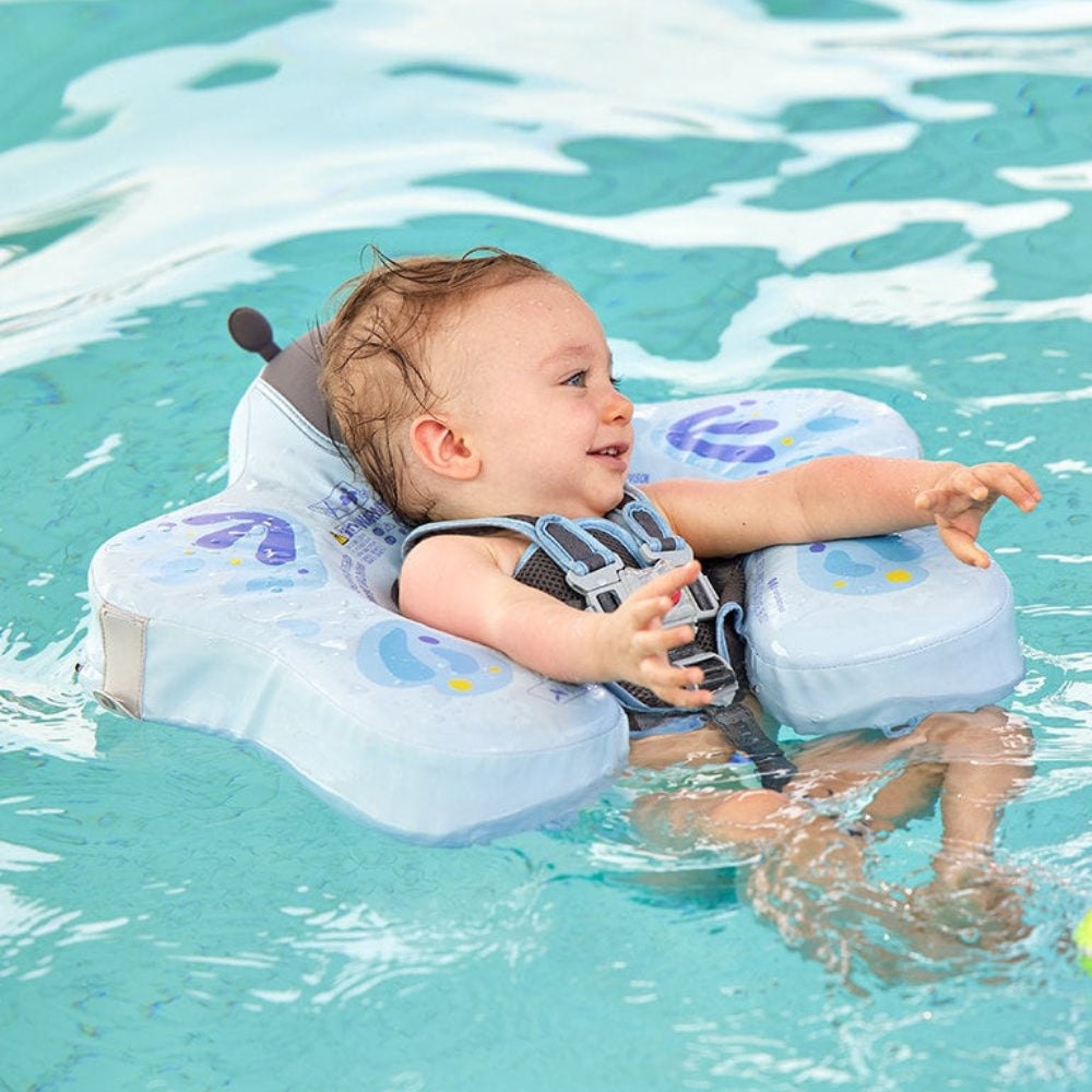 Infant safely swimming in a pool using the Mambobaby™ Butterfly Float for water confidence.