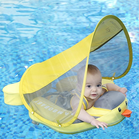 A baby safely enjoying the water in a Mambobaby™ Duck Float, demonstrating stable 360-degree protection in a pool.