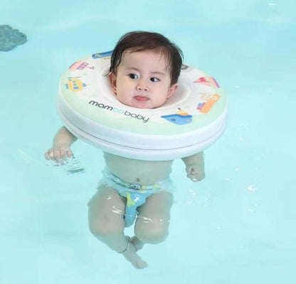 Infant safely enjoying the water and paddling in a Mambobaby™ Boats Neck Float.
