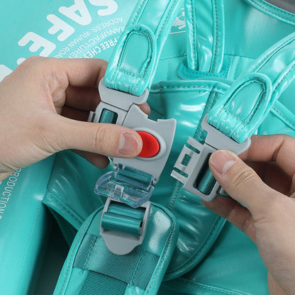 Close-up of the Mambobaby™ child-proof safety lock and unlock button on the 5-point harness system.